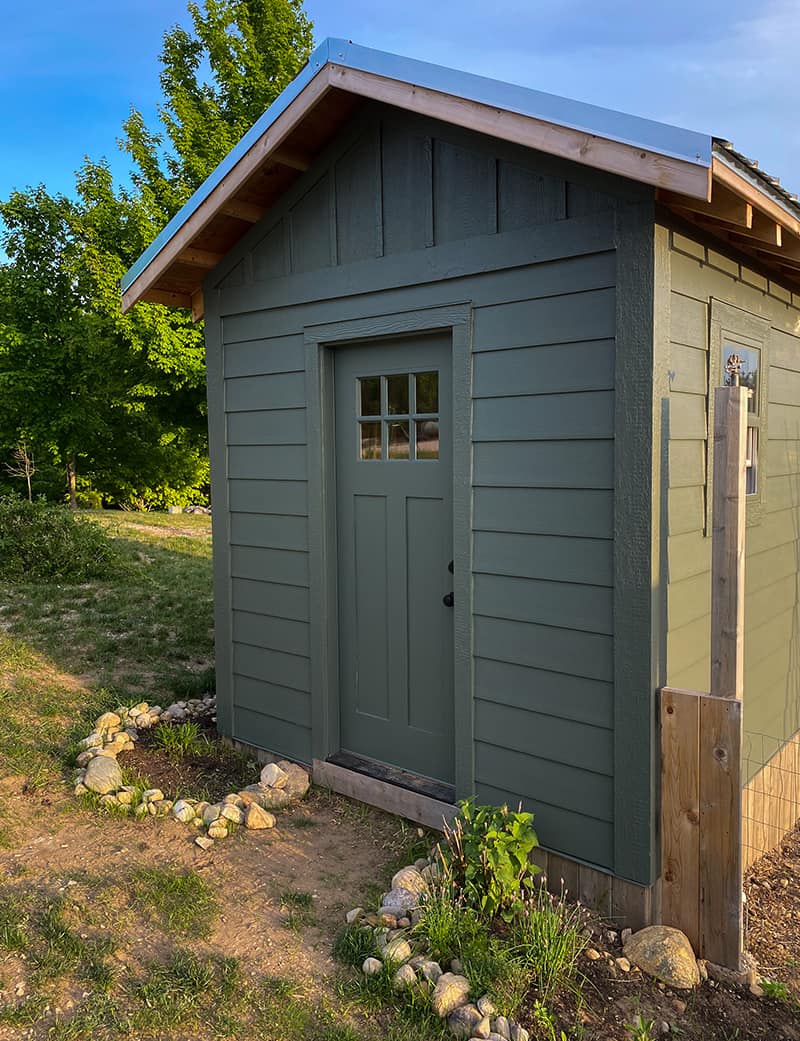 Exterior of a large chicken house with storage space