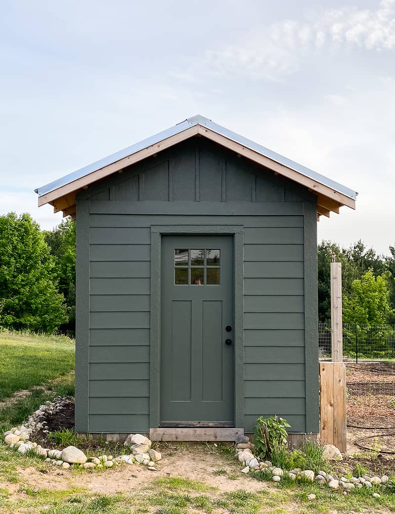 Completed Chicken Coop with board and batten in a vermilion green color