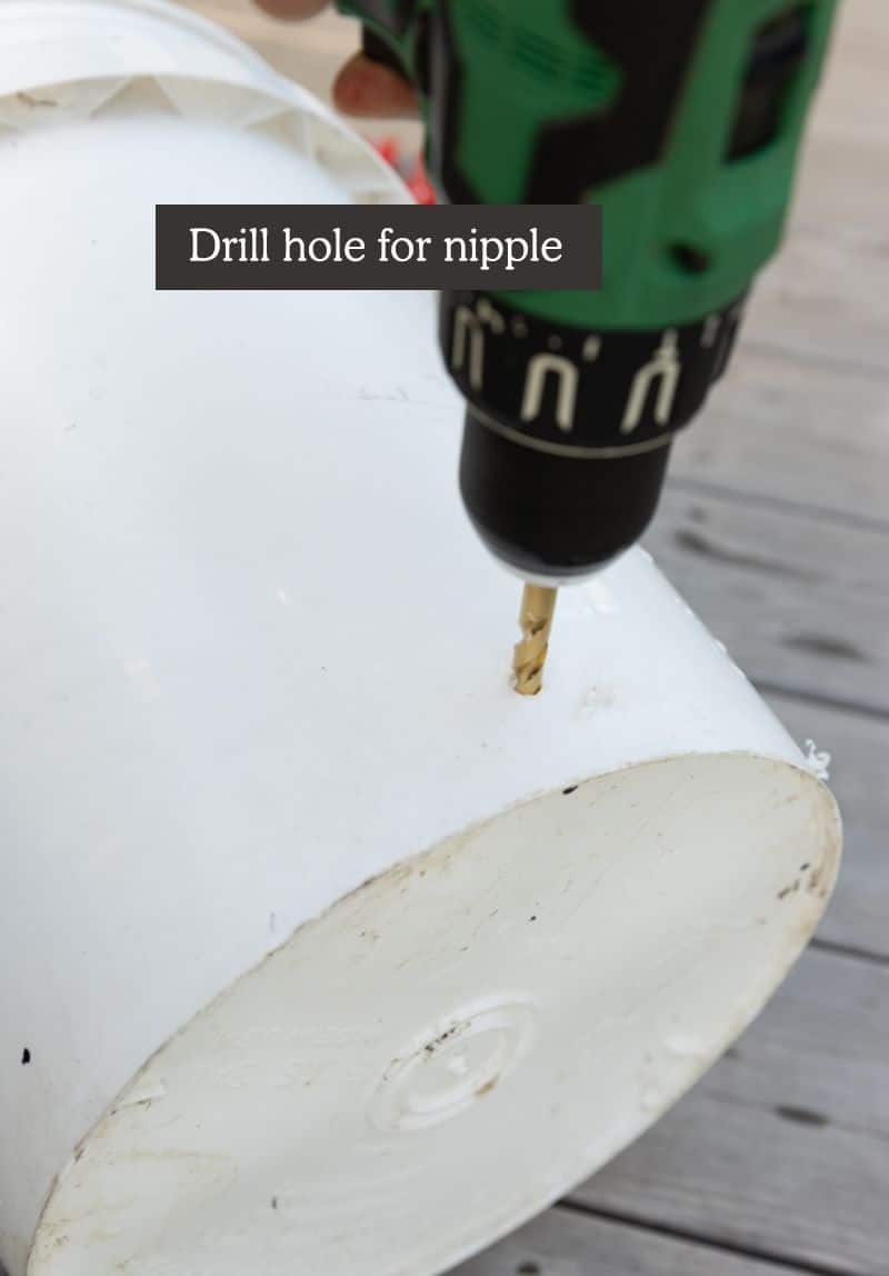 best homemade chicken feeder diy - drill hole for nipple