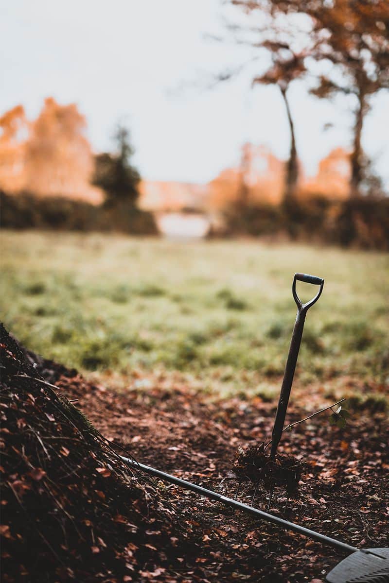 gardening with compost - a shovel on the ground