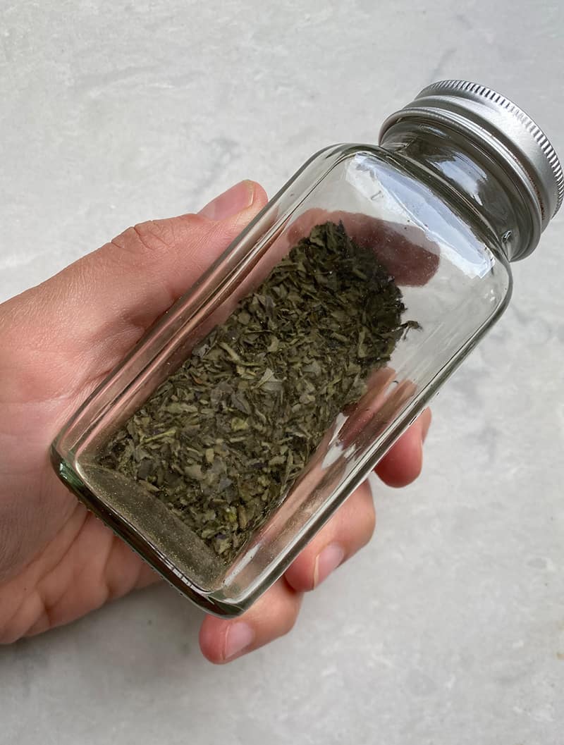 Dried basil stored in a jar