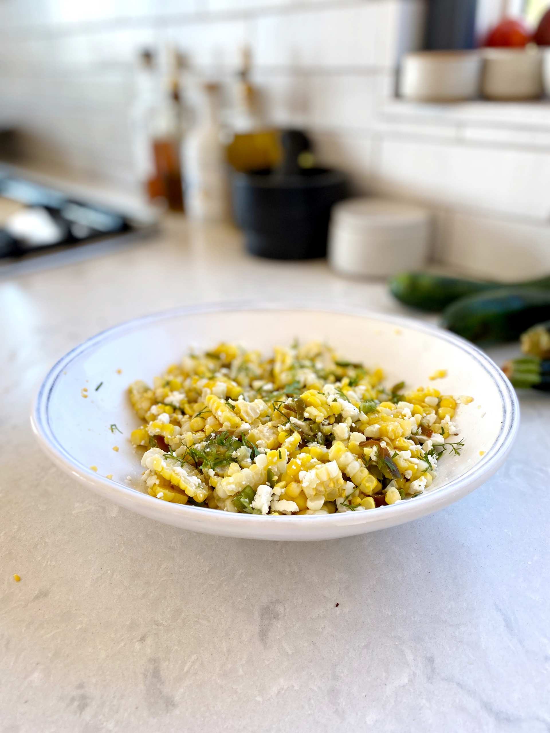 Healthy Grilled Corn Salad - a bowl of grilled corn corn salad with different toppings