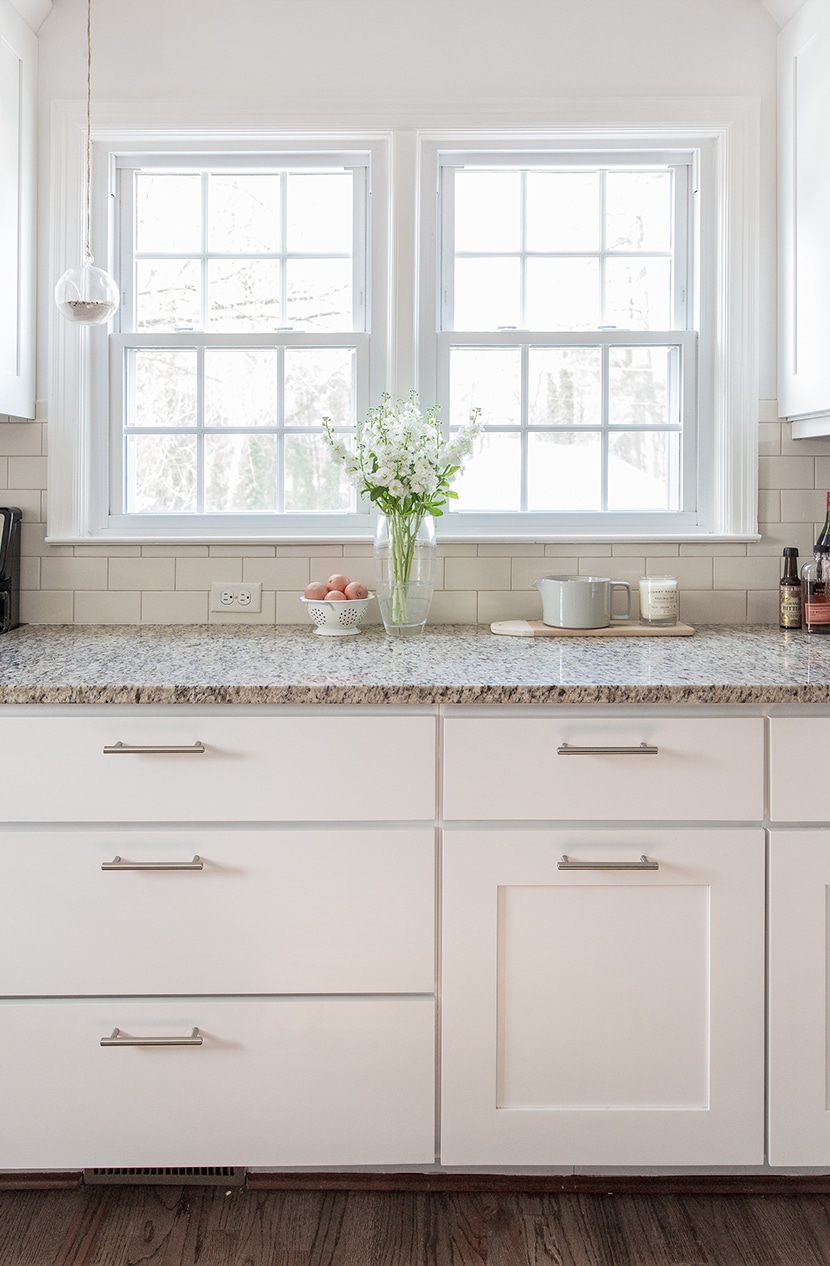 Freshly painting kitchen cabinets white without any other changes 