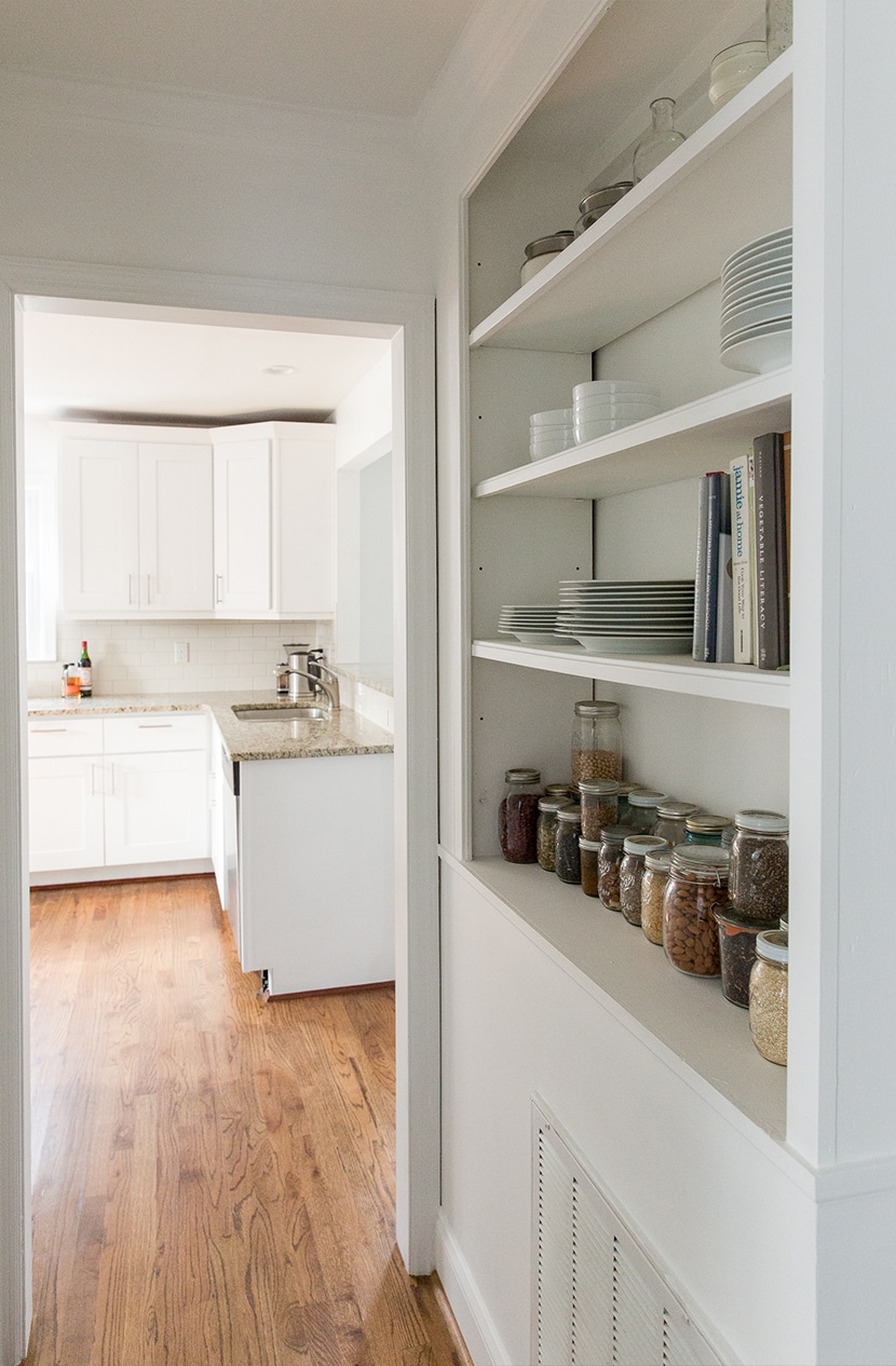 open shelving in hall way painted white