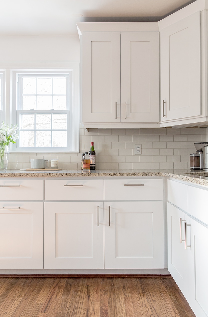 simple modern white kitchen cabinets with white tile