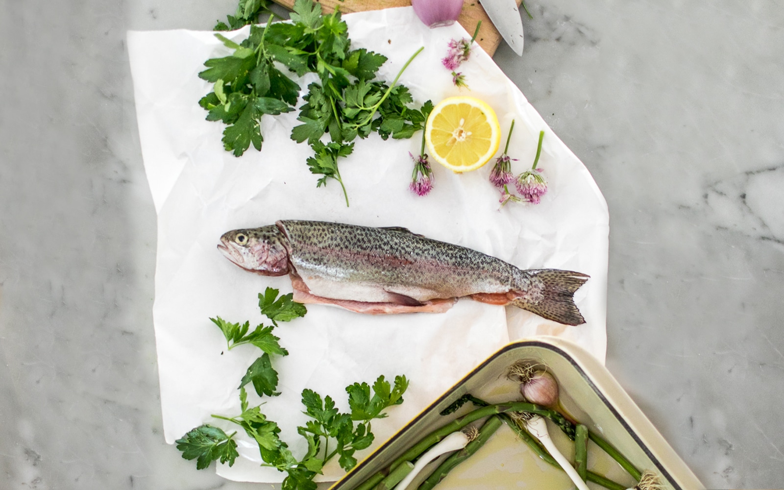 A Recipe for a simple way to bake a whole Rainbow Trout this summer. Get the Recipe on The Fresh Exchange.